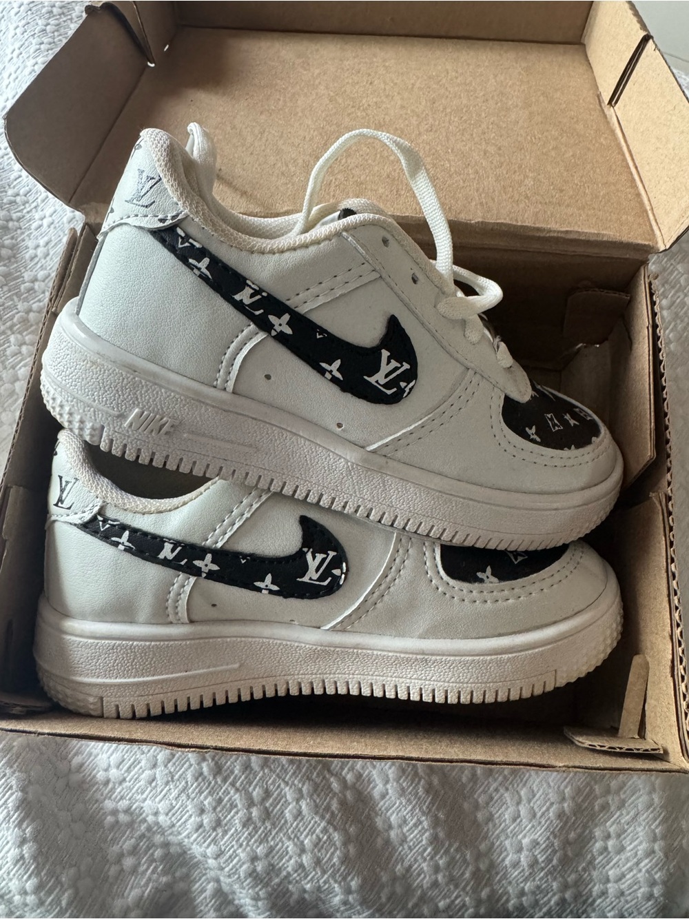 Nike Kids White Sneakers with Black Patterned Swoosh